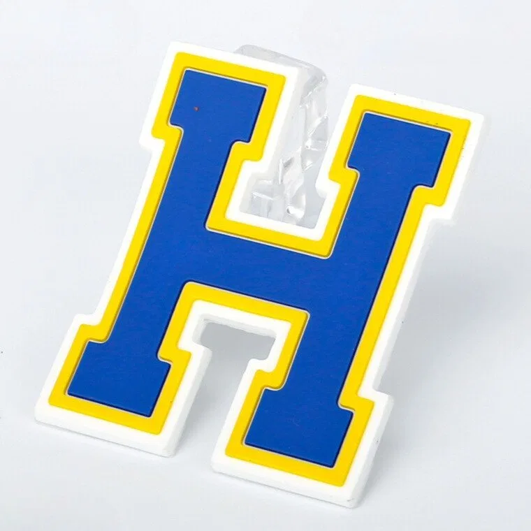 Generic letterform shown as a raised silicone logo patch reference