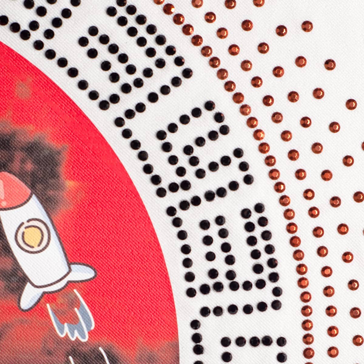 hotfix rhinestone transfer and printed hotfix transfer, combined with a simulated Austrian rhinestone and a printed spaceman pattern, with adhesive rhinestone transfers