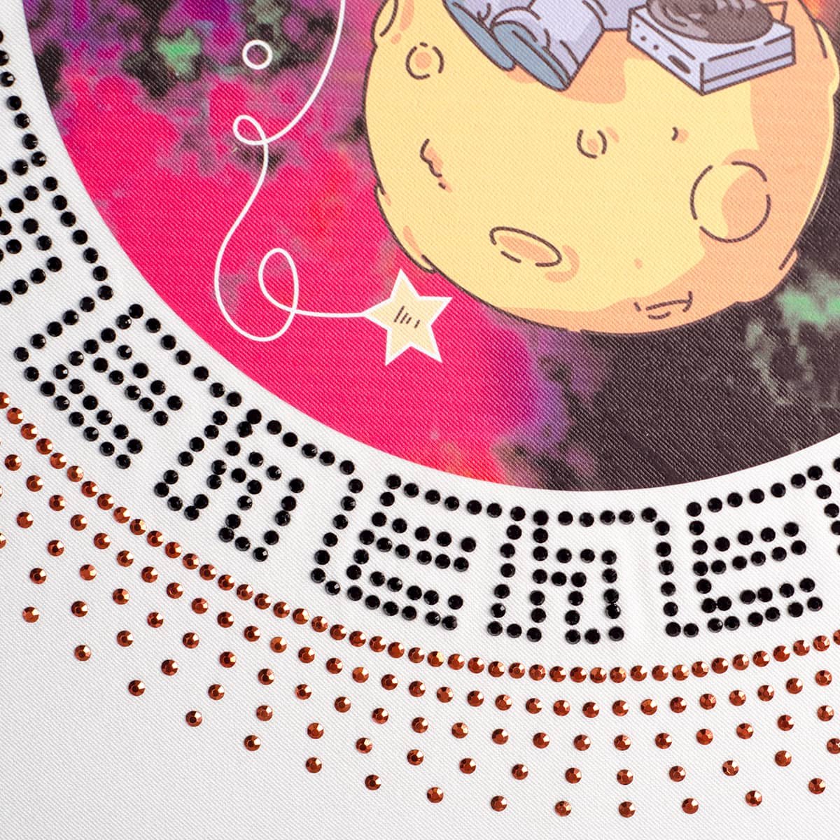 hotfix rhinestone transfer and printed hotfix transfer, combined with a simulated Austrian rhinestone and a printed spaceman pattern, with adhesive rhinestone transfers