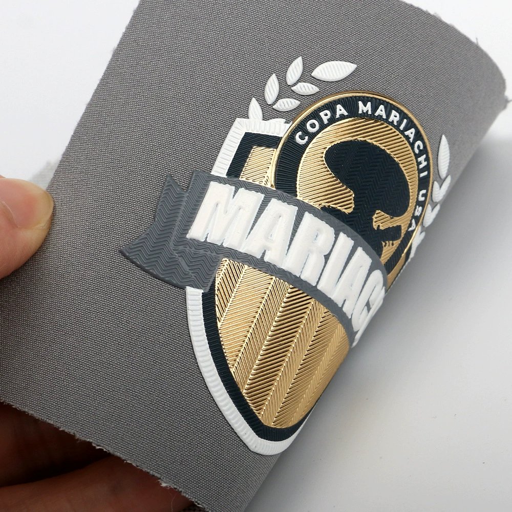 Custom 3D TPU Soft Rubber Logo Patches – Gold & Silver Eco-Friendly Embossed Labels for Clothing