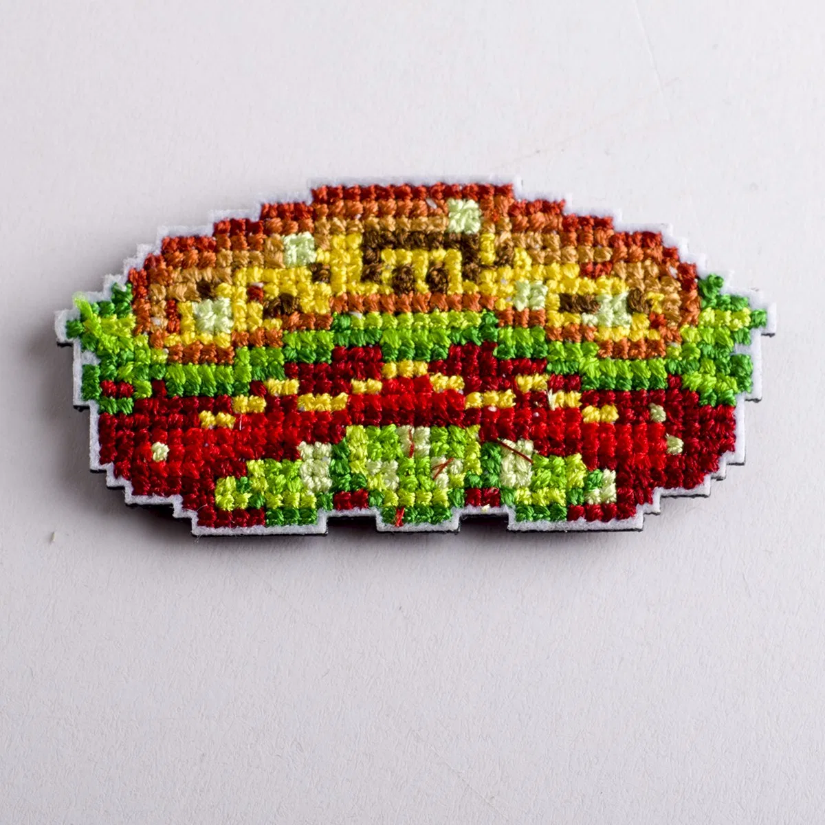 Embroidered badge reference shown in garment context
