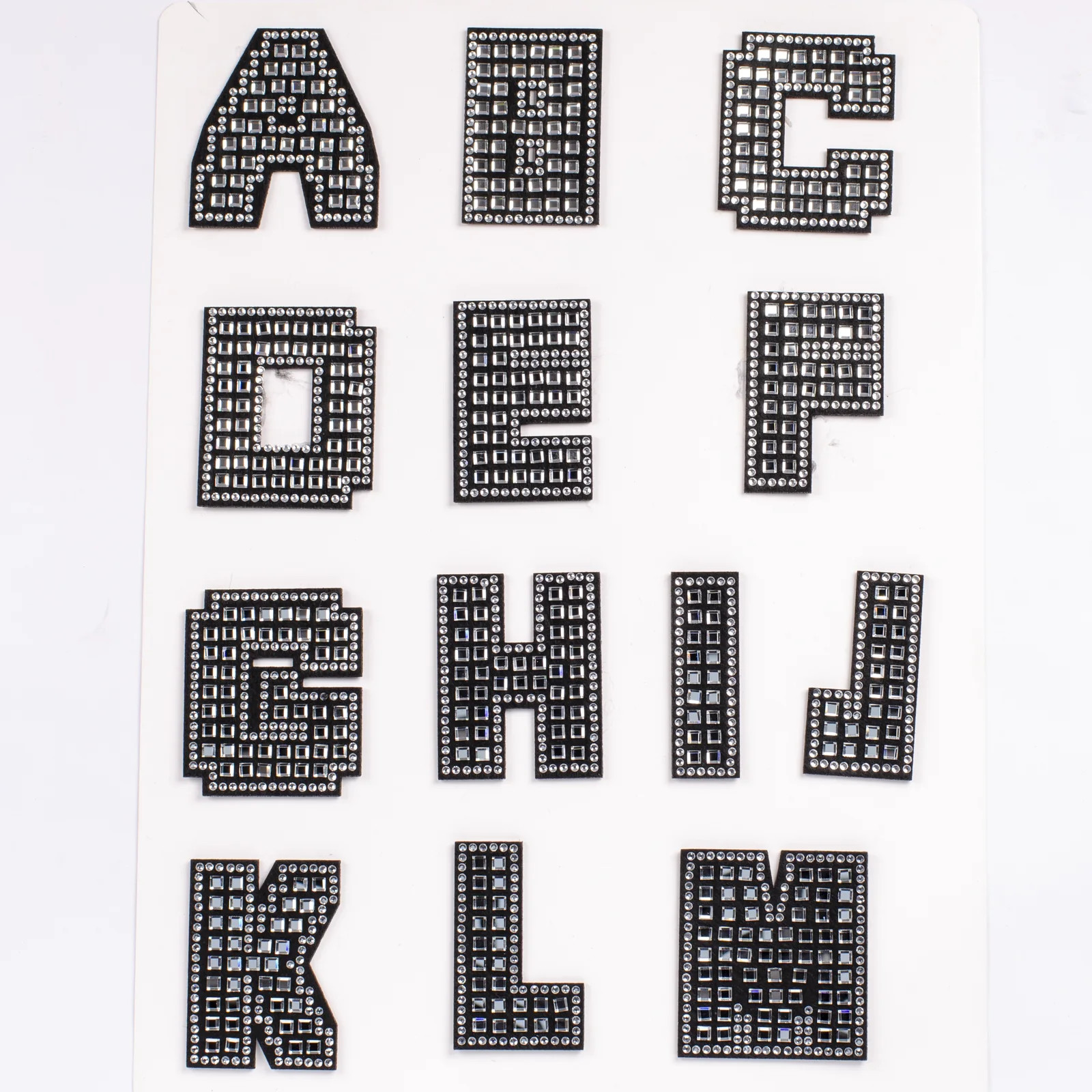 Black alphabet patches with square crystal grids and round rhinestone borders