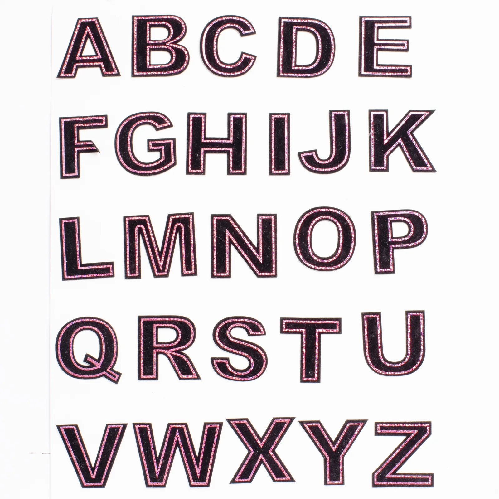 Black laser-cut uppercase letter appliques with pink metallic inset outlines