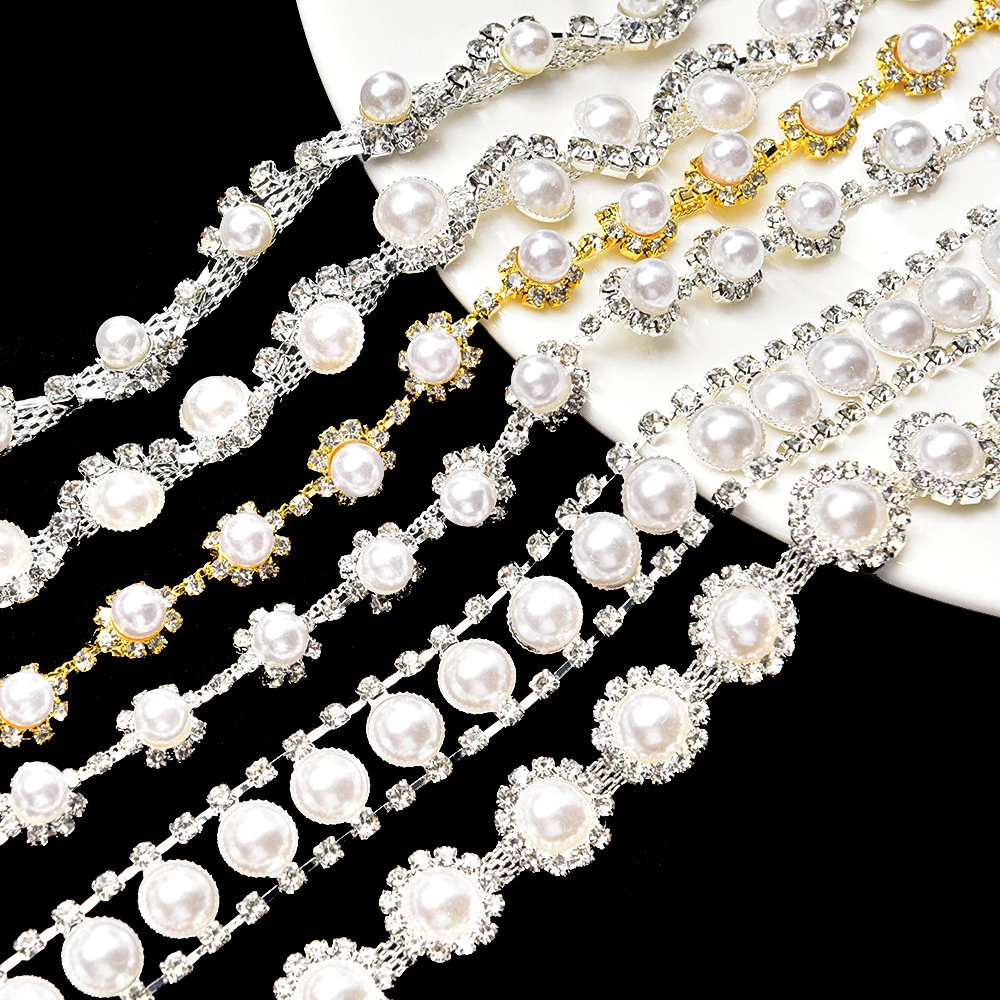 Nine pearl-look rhinestone chain motifs with rows curves pendants semicircles and crosses