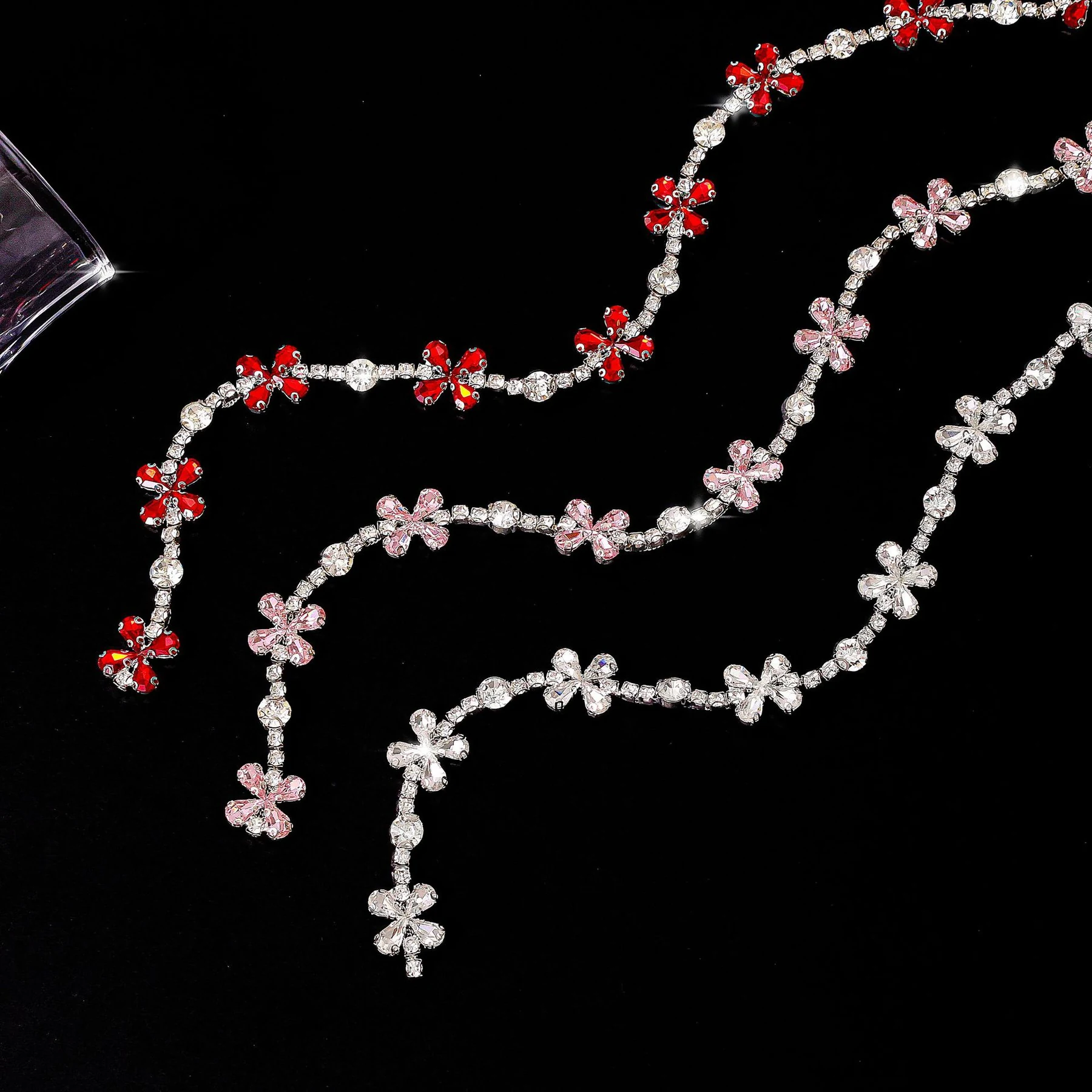 Four-petal rhinestone flower chain in clear, red and pink crystal colors