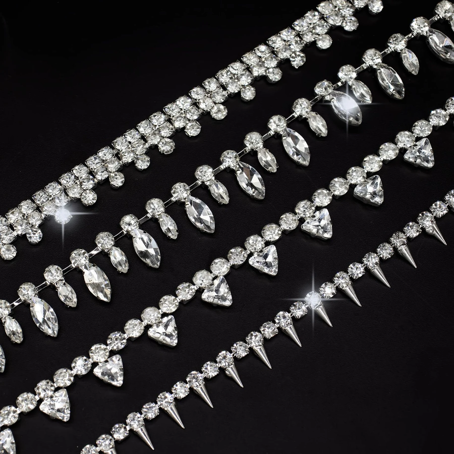 Five geometric rhinestone drop chain designs in clear crystal