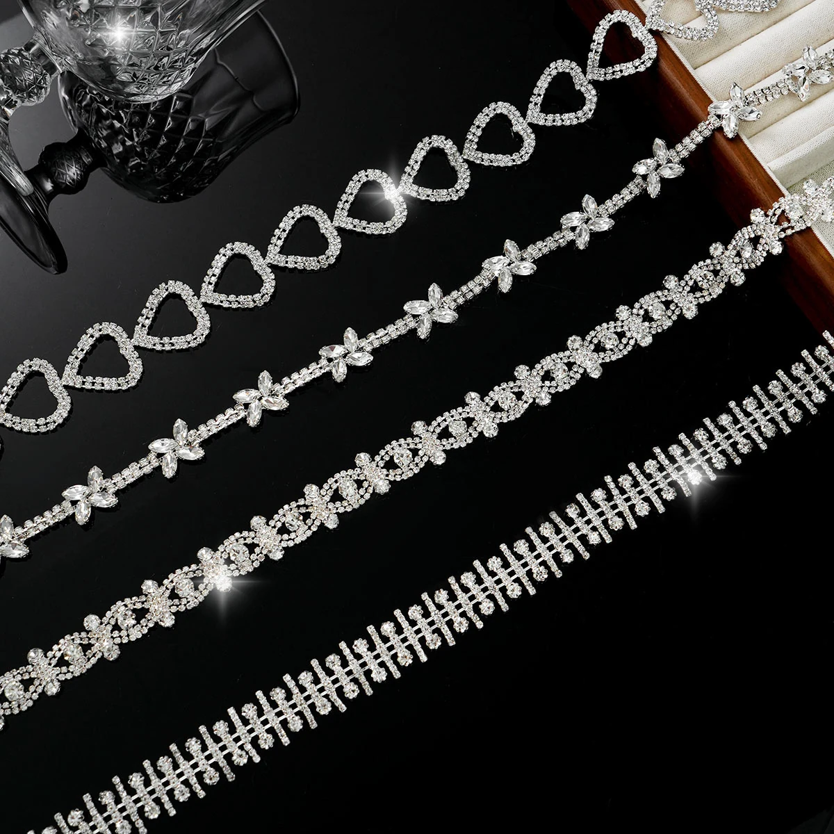 Four clear crystal chain designs including petals hearts ovals and bar rows