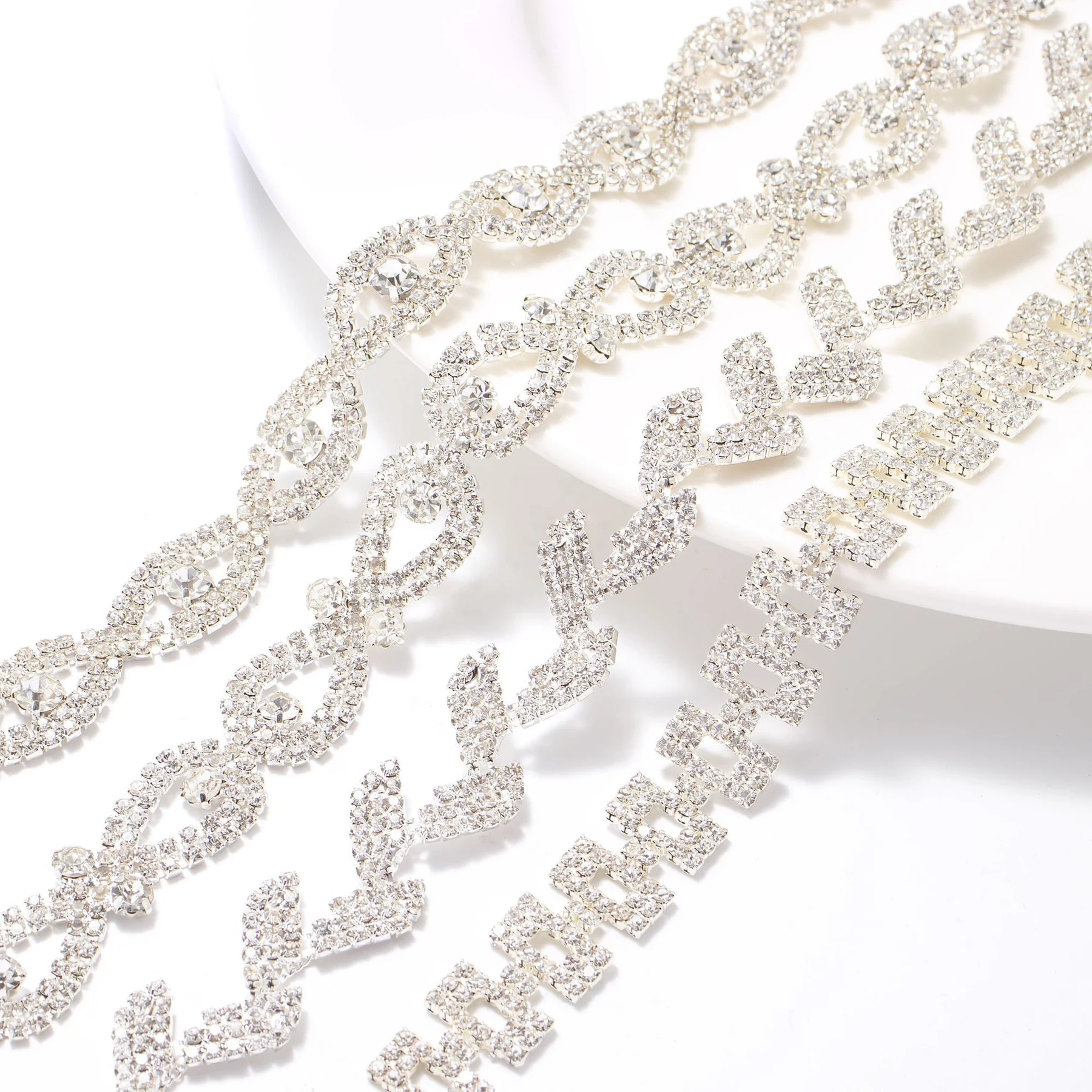 Clear rhinestone leaf double-ring and geometric chain designs