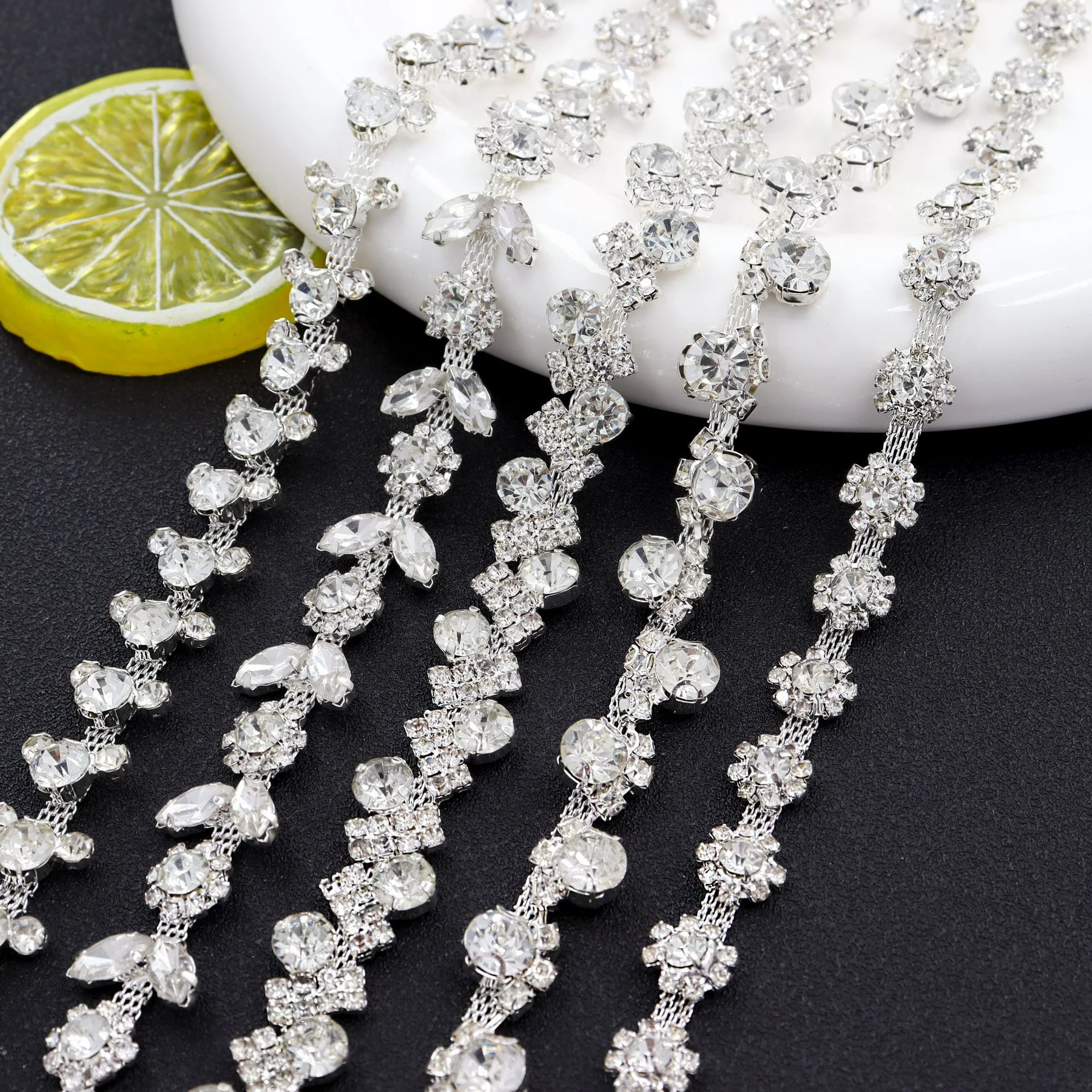 Floral S-shaped and staggered rhinestone chain patterns
